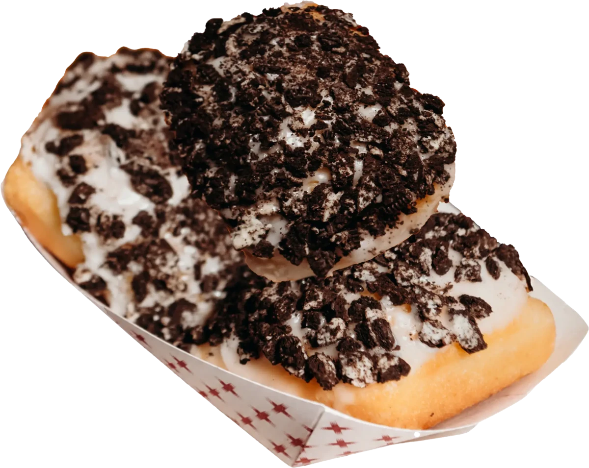 Tray of two Cookies and Scream Beignets topped with cookie crumbles