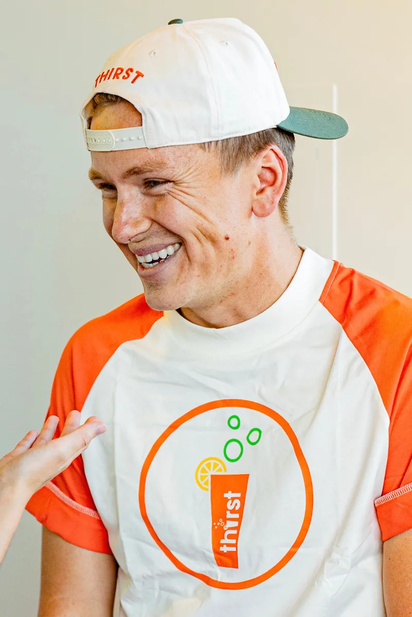 Thirst team member laughing with a customer