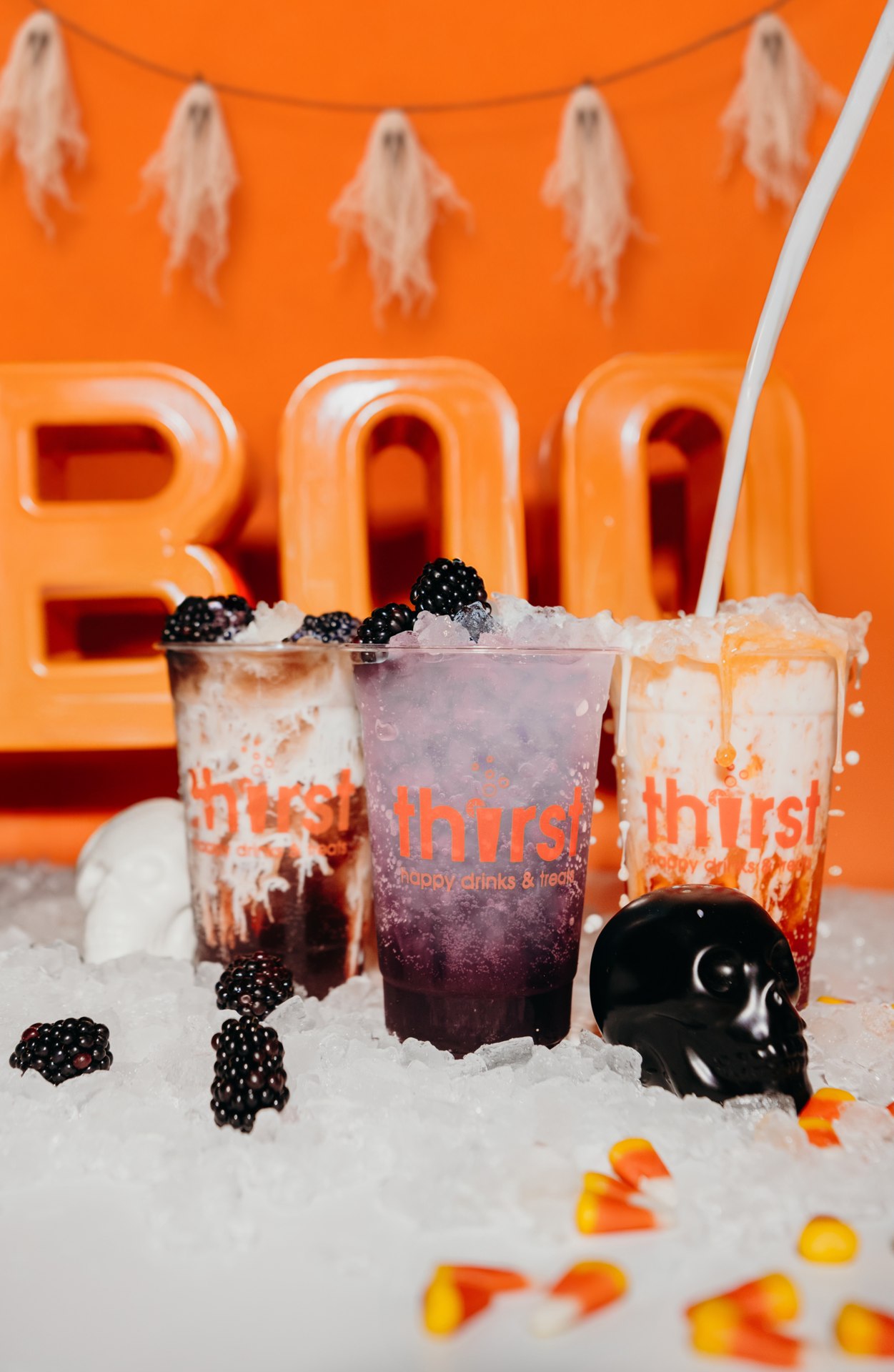 Thirst Halloween drinks with ghost decorations and candy corn