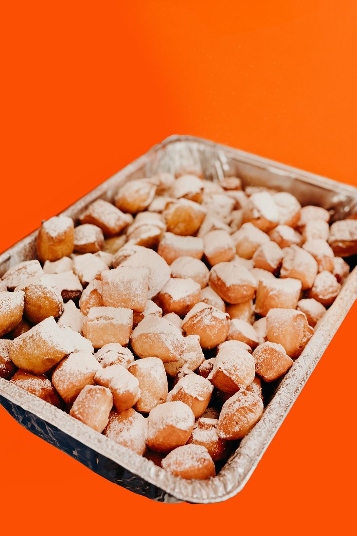 A tray of Thirst beignet bites dusted with powdered sugar